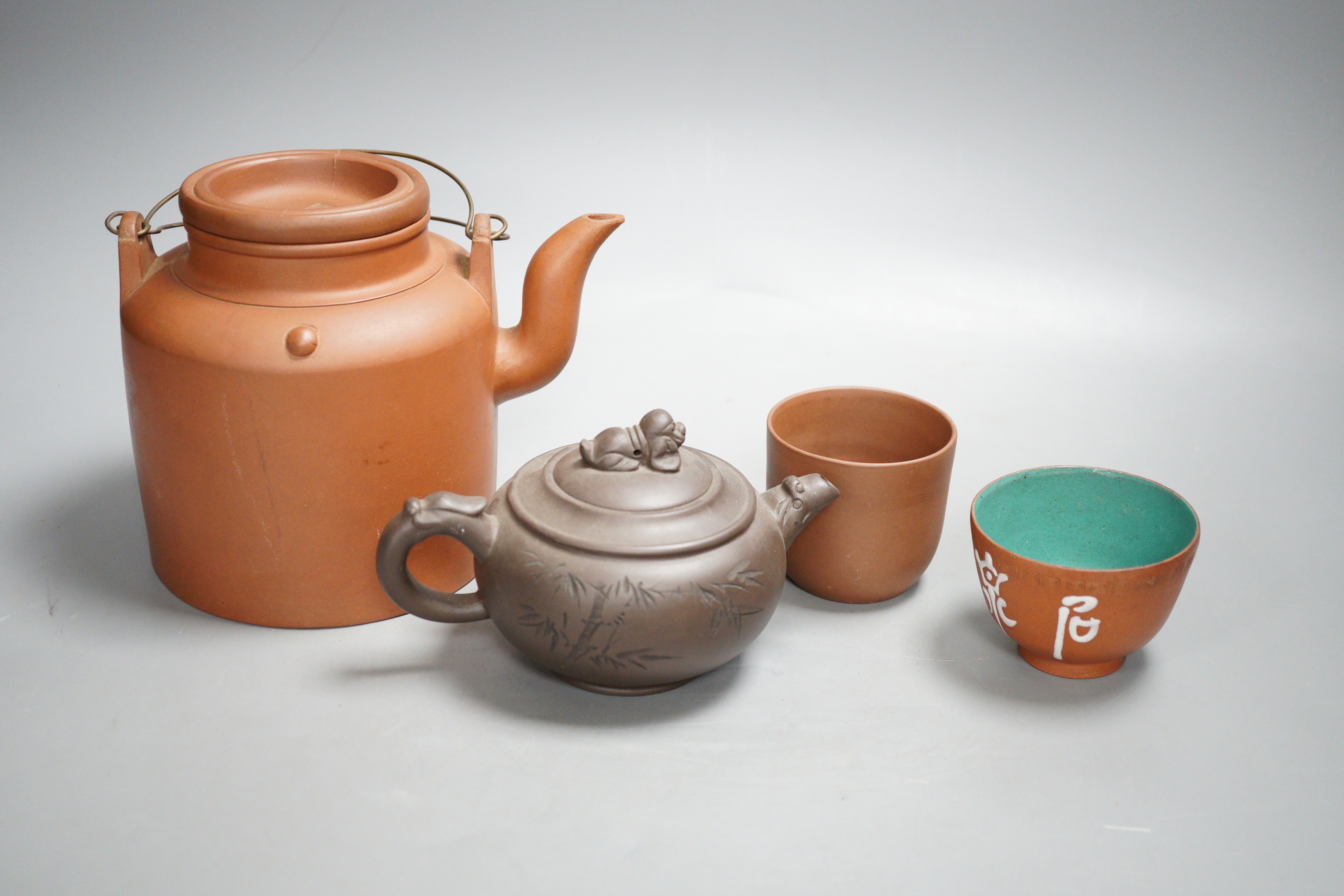 Two Chinese Yixing teapots and two similar teabowls. Tallest 14cm